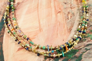 Beautiful 3 Strand Necklace featuring Genuine Turquoise, Red Jasper, Blue Lapis, Spiny Oyster Shell and Picture Jasper. Olive Shell Heishi Spacers. Sterling Silver Beads, Cones and Clasp. The photo is of the necklace you will be receiving. Created by Santo Domingo Artist Carol Pacheco. The Santo Domingo Pueblo is in New Mexico, near Santa Fe.
